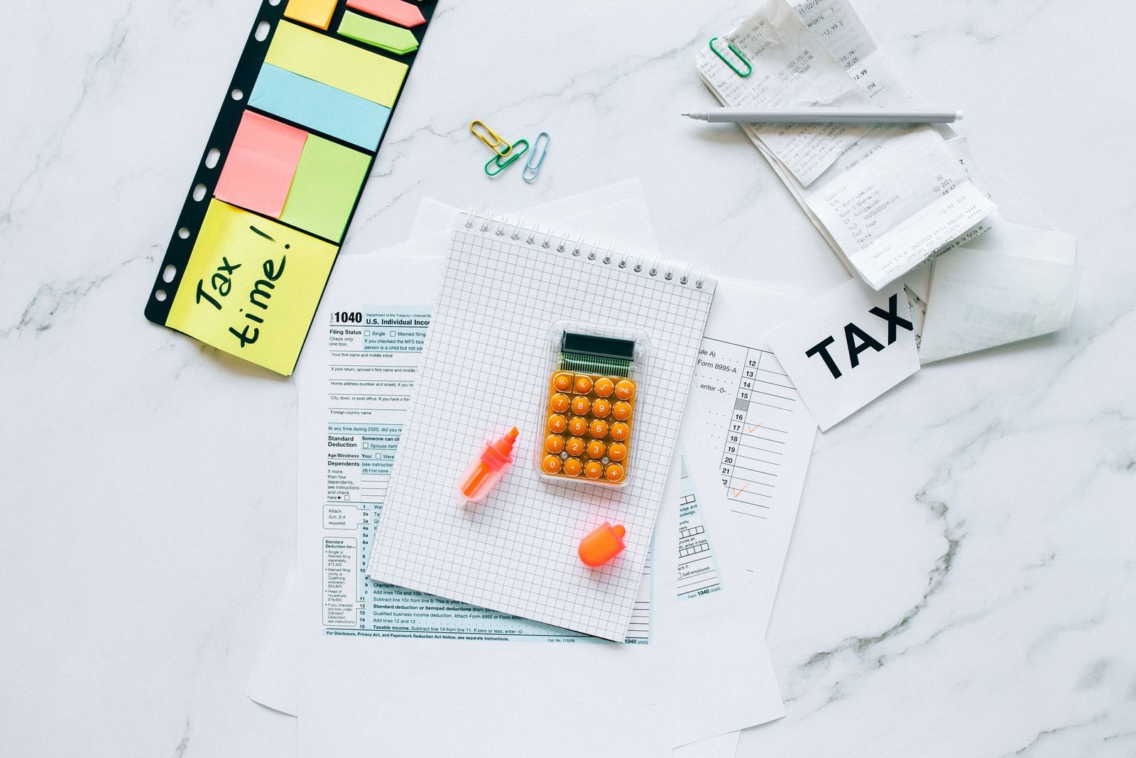 US tax forms with calculator and Tax Time notes