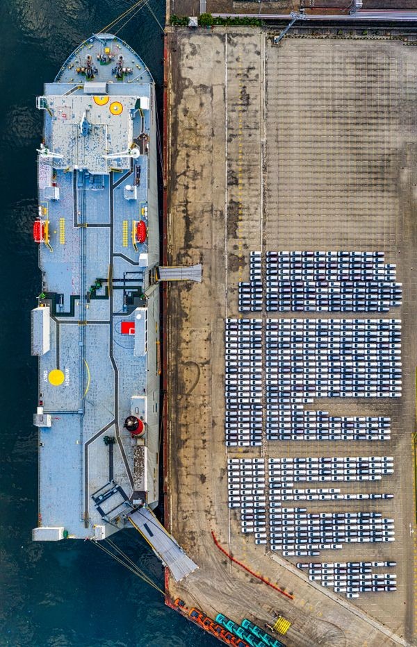 Cars at port being loaded onto RoRo vessel