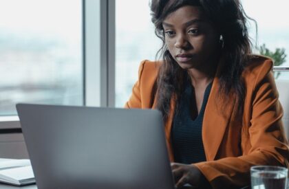 kra-tax-filing-kenya-2026-v3 African businesswoman working on tax filing on her laptop
