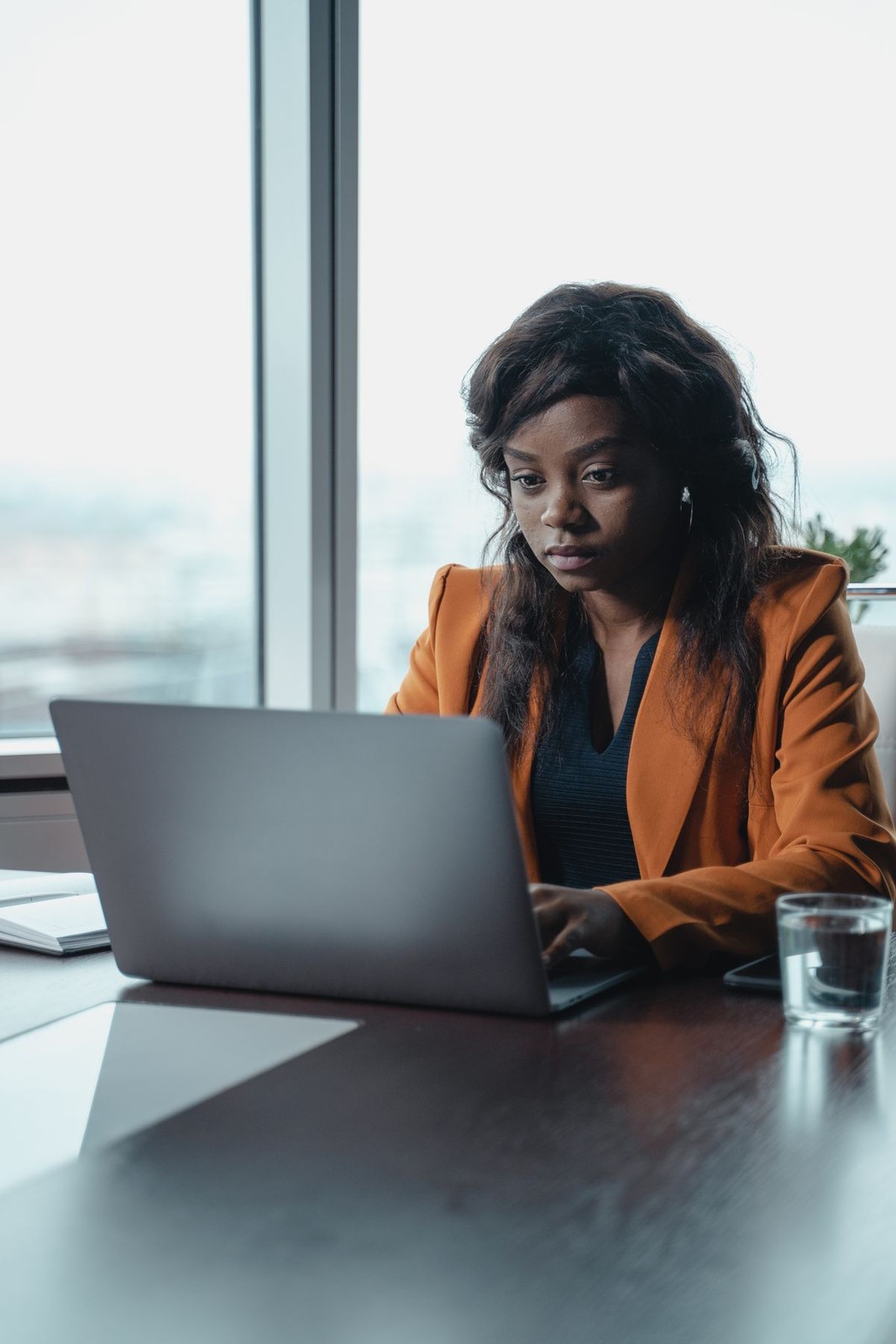 African businesswoman working on tax filing on her laptop
