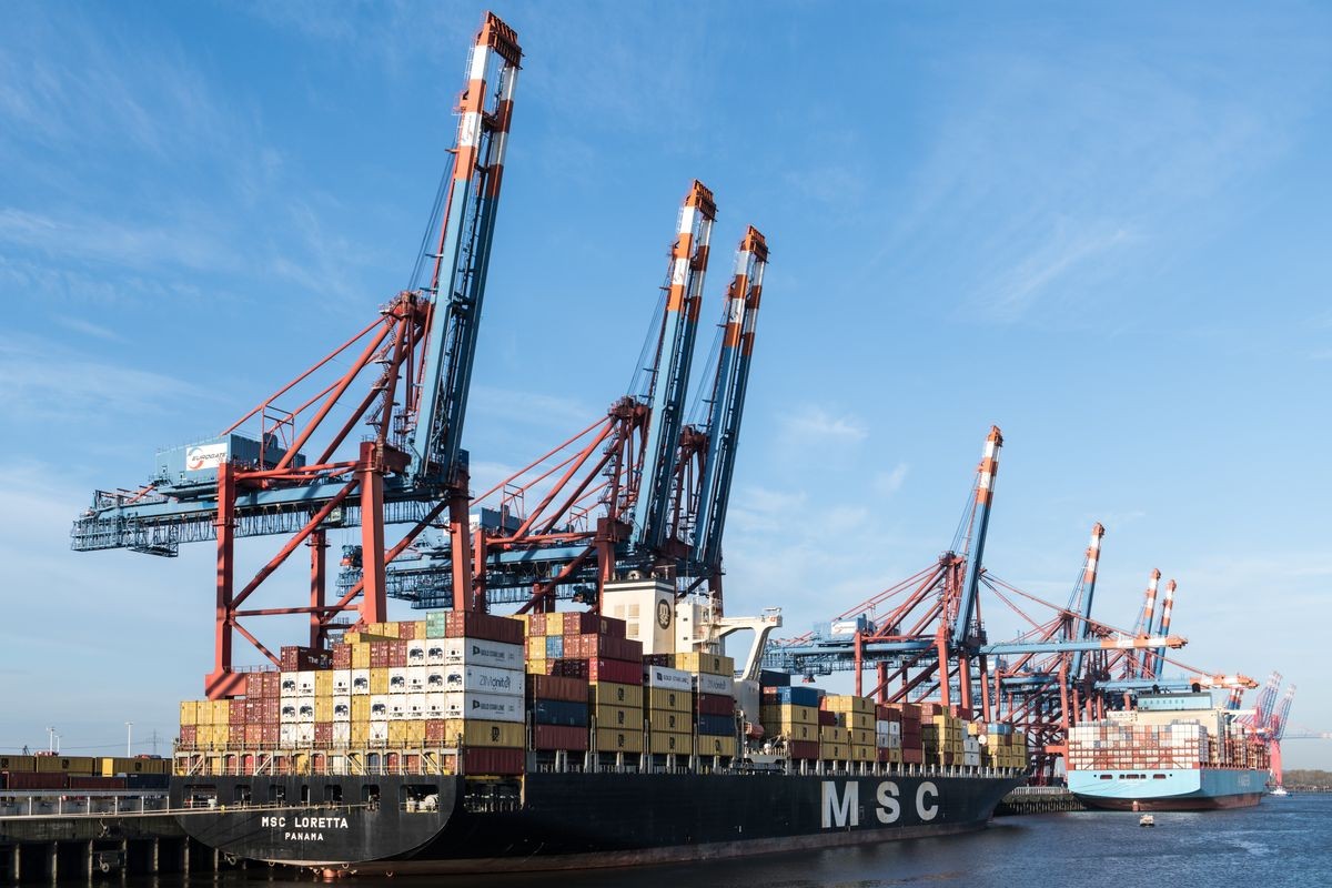 Container ships docked at a busy port