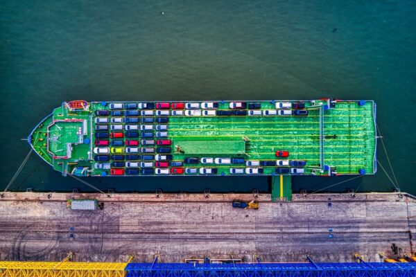 ship-car-usa-kenya-2026-v3 Aerial view of a car carrier ship loaded with vehicles
