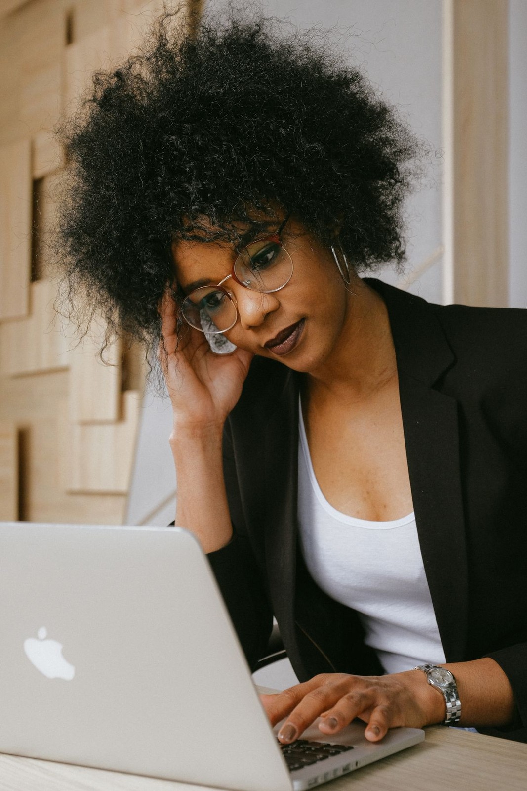African businesswoman doing bookkeeping on a laptop